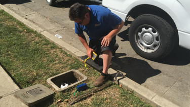 San Jose Water Employee looking at a water meter