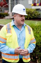 Photo of Gil Rivas in hard hat and safety vest