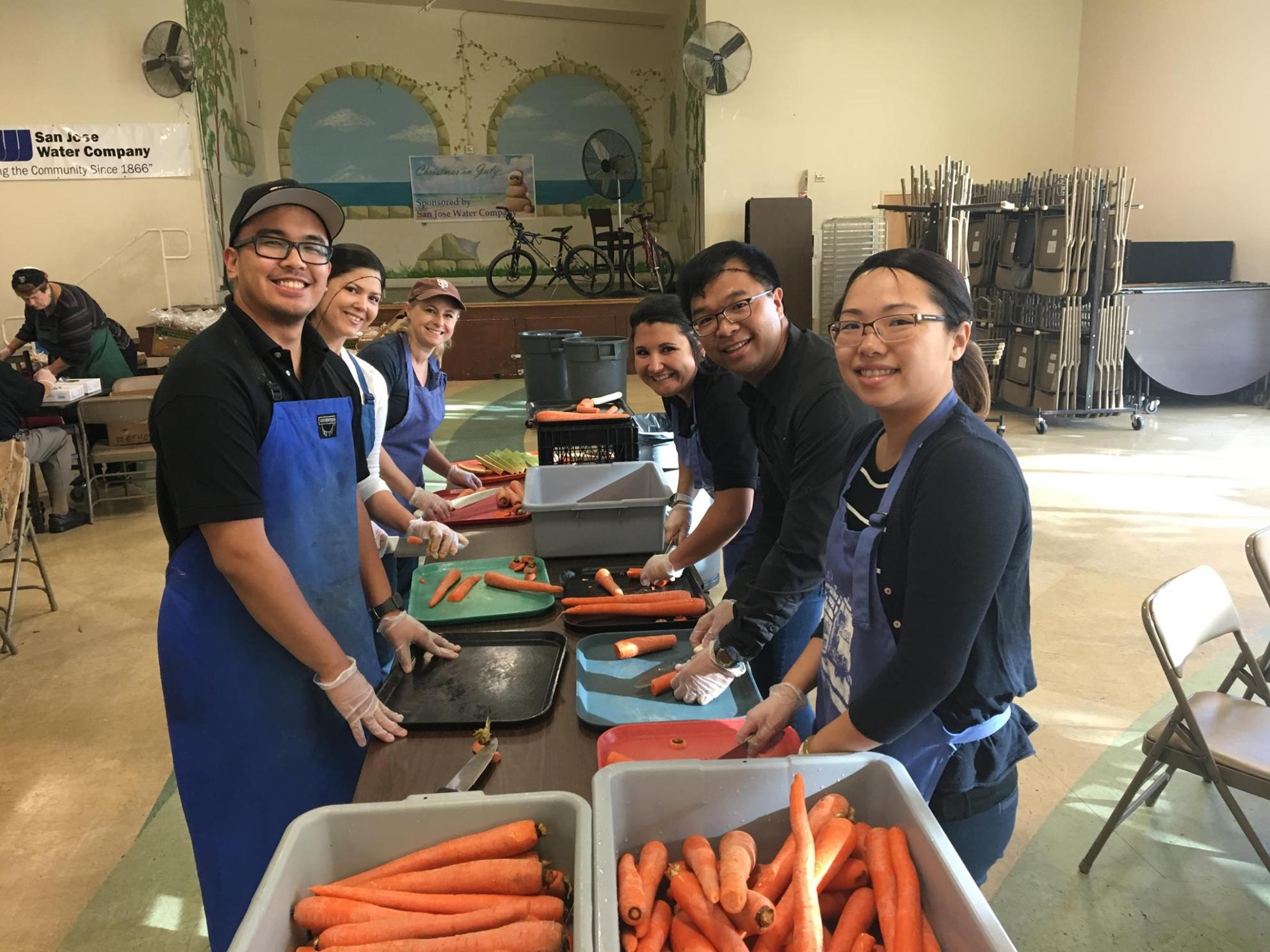 Team members serving healthy food