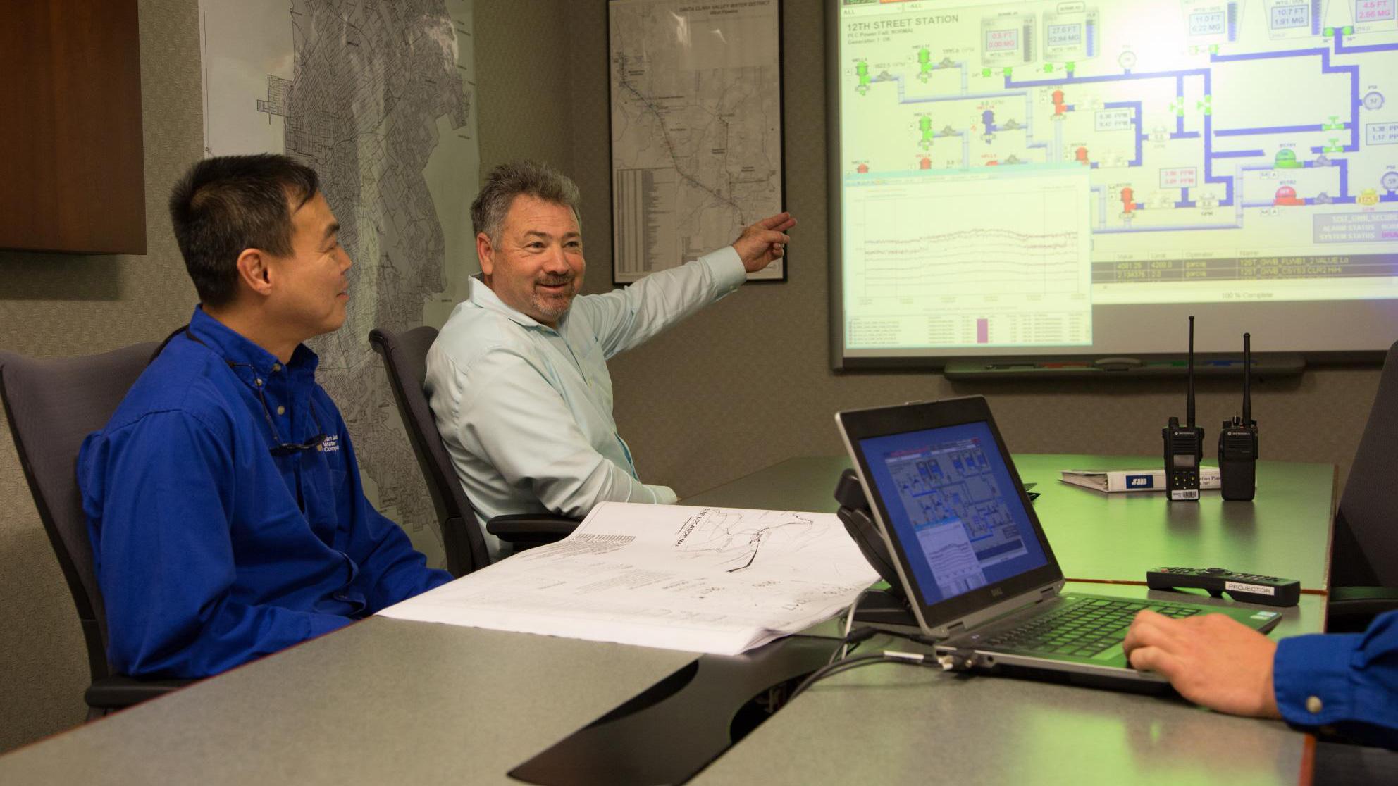 Tinh Bui (Systems Operator) and Mark Taormina (Operations Supervisor)
