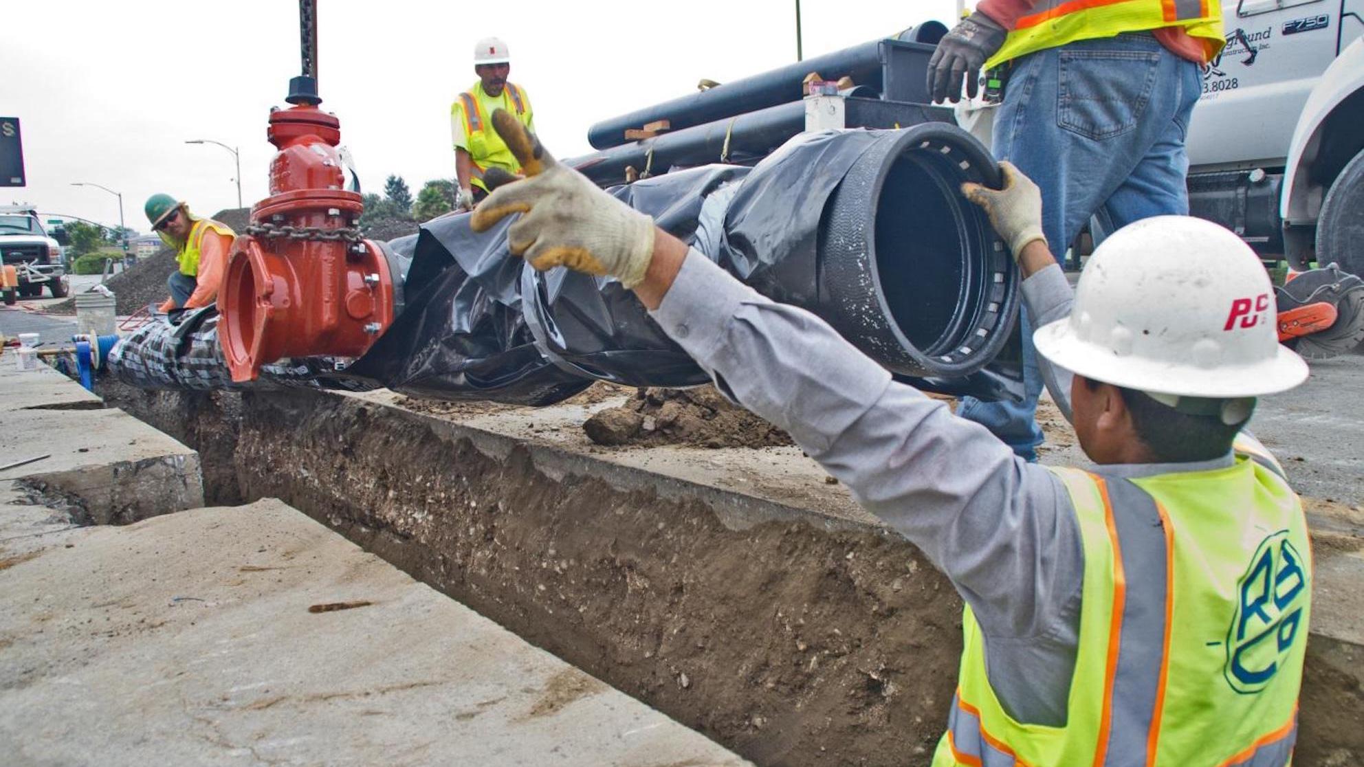 SJW employees updating water pipe