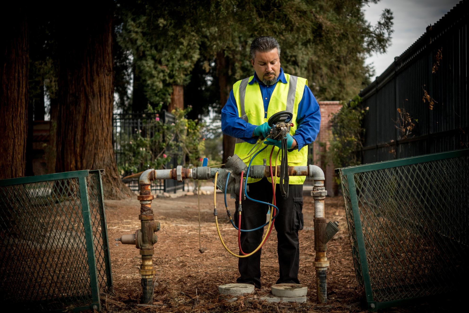 Technician Analyzing Water Backflow